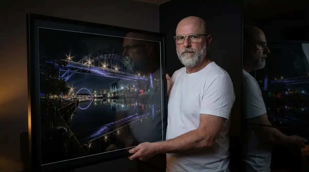Michael Paul Bennett holding a large print of his award winning Tyne Bridge Photo