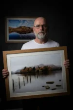 Michael Paul Bennett holding a lake district print