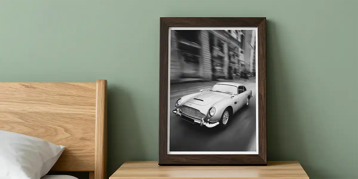 Aston Martin Digital Art Print in A3 frame in bedroom leaning on cabinet