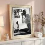 Audrey Hepburn print on pink wall