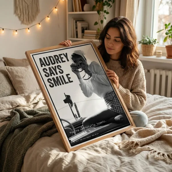 Woman holding large Audrey Hepburn black and white print