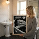 Woman holding A Corking Bath print in bathroom