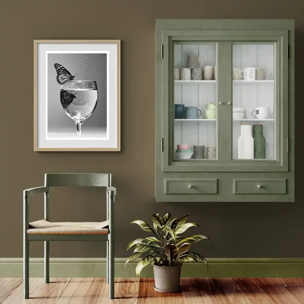 Moment of Duality print next to green cabinet