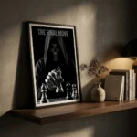 Framed black-and-white poster titled 'THE FINAL MOVE' showing a hooded skull holding a chess piece, leaning on a wooden shelf with a vase and books nearby.
