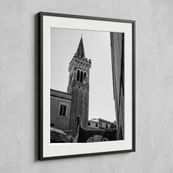 Campanile dei Cappuccini print by Mark Marsh Framed Taormina bell tower black and white digital wall art print by Mark Marsh, showing the multi-tiered stone campanile and pointed spire detail.