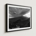 Framed Mount Etna storm black and white digital wall art print by Mark Marsh, showing the wrought-iron balcony railing and billowing volcanic steam detail.