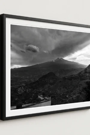 Framed Mount Etna storm black and white digital wall art print by Mark Marsh, showing the wrought-iron balcony railing and billowing volcanic steam detail.