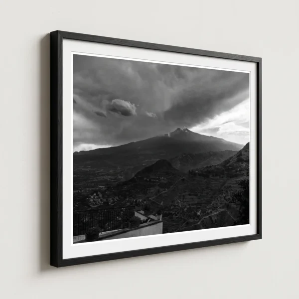 Etna Storm black and white digital print by Mark Marsh Framed Mount Etna storm black and white digital wall art print by Mark Marsh, showing the wrought-iron balcony railing and billowing volcanic steam detail.