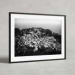 Taormina rooftops black and white digital download print in a black frame, capturing the Sicilian hilltop town by Mark Marsh.