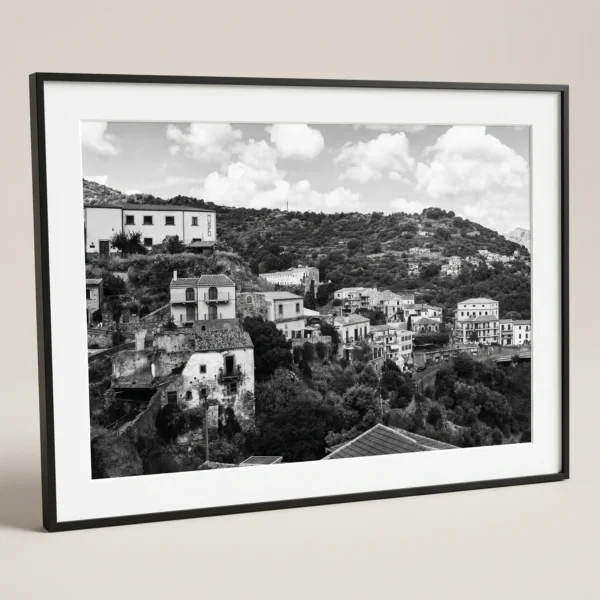 Lower tiers and main valley entry of Savoca digital download by Mark Marsh in black frame Framed Savoca Sicily black and white digital wall art print by Mark Marsh, showing the crumbling stone houses, traditional balconies, and layered village detail.