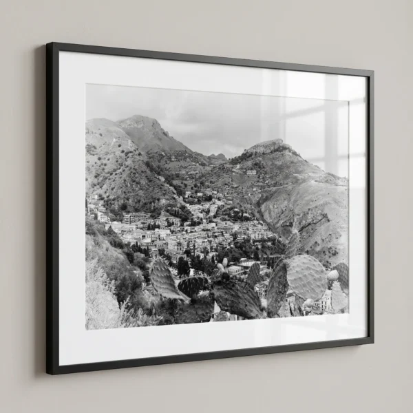 Mountain landscape and hillside buildings of Taormina printable art by Mark Marsh printed at A2 size Taormina theatre back view black and white digital download print in a black frame.