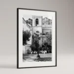 Framed Taormina piazza black and white digital wall art print by Mark Marsh, showing the cast-iron lamppost, decorative brackets, and checkerboard tile floor detail.