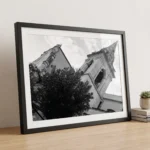 San Giuseppe campanile black and white digital download print in a black frame, styled in a study with wood textures, capturing Sicilian Baroque drama by Mark Marsh.