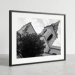 Framed Taormina bell tower black and white digital wall art print by Mark Marsh, showing the open belfry arches, decorative mouldings, and pyramidal spire detail.