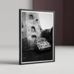 Framed Castelmola Sicily black and white digital wall art print by Mark Marsh, showing the decorated Fiat 500 hood and the textured volcanic stone street detail.