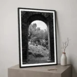 Taormina Ancient Theatre black and white digital download print in a black frame, styled on a plinth, capturing the Sicilian archaeological site by Mark Marsh.